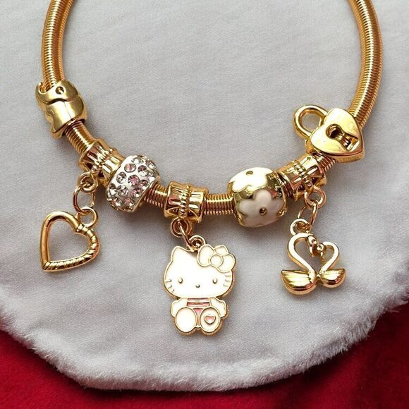 Hello Kitty White Heart Lock Swan Gold Tone Stretch Charm Bracelet - Picture 2 of 2